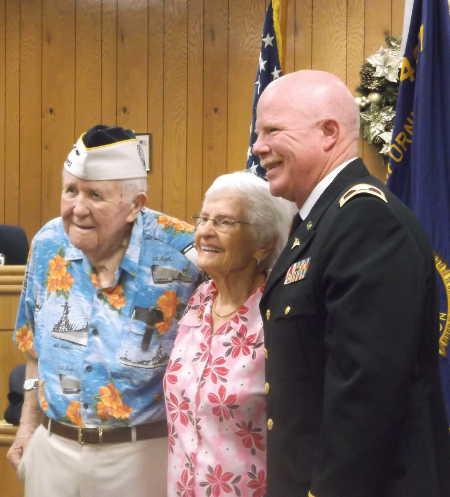 From left, Pearl Harbor survivor Bill Slater; Alice Darrow, widow of sailor Dean Darrow, who also survived the attack; and Col. Bradley Clair, MD. Photo by Elizabeth Larson/Lake County News. 120714pearlharborgroup
