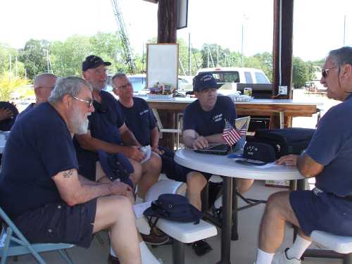 Flotilla Commander Gary Dromi (center) conducts Team Coordination Training (TCT) review for (from left) Harold Hauk, Bob Gerbi, Jerry Gilmore and Angelo Perata (far right) during the annual tie out, held Friday, June 1, and Saturday, June 2, 2012, in Lake County, Calif. Photo courtesy of Flotilla 88. 060112tieoutgroup