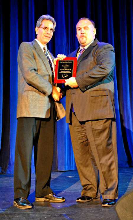 Richard Schaut, left, English teacher at Middletown High School in Middletown, Calif., receives the Lake County Teacher of the Year plaque from his principal, Bill Roderick, at the 18th annual Lake County Teacher of the Year and Excellence in Education Award Program, held Saturday, November 3, 2012, at the Soper-Reese Community Theatre in Lakeport, Calif. Photo by Teresa Dixon. richardschautaward