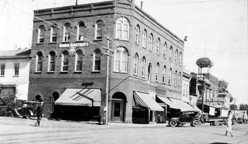 The Monroe Apartments dominated the corner of Third and Main Streets in the 1920s. Nearly every building that appears in this picture burned on April 20, 1926. Courtesy of Lake County Museum. lakeportfiresmonroeapts1920s
