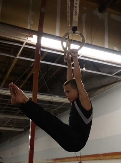 Eight-year-old Alex Fordham practices on the rings at Skycatch Gymnastics, on Wednesday, March 9, 2016, ahead of the NorCal Level 4-5 State Championships in San Luis Obispo, Calif., where he will compete on Saturday, March 12, 2016. Photo by Elizabeth Larson/Lake County News. 030916alexfordhamrings