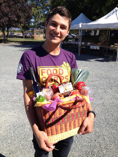 Ben Feldman, the current Lake County FoodCorps service member, stopped by the Lake County Farmers’ Market at Steele Wines in Kelseyville, Calif., to meet local farmers and sample some of the fresh fruits and vegetables that he introduced to the students in the Konocti Unified School District during the 2015/16 school year. Photo courtesy of North Coast Opportunities. benfoodcorps