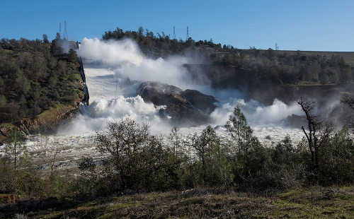 On Sunday, February 12, 2017, the California Department of Water Resources discharged 55,000 cubic feet per second of water from the damaged spillway of the Lake Oroville dam in Oroville, Calif. Kelly M. Grow/ California Department of Water. 021217orovilledamspillway