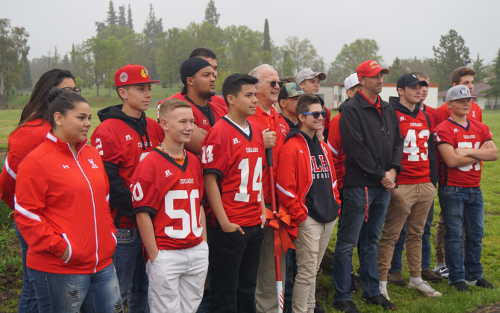 Student athletes gather with Ron Raetz for the groundbreaking of the new light installation at the Upper Lake High School stadium in Upper Lake, Calif., on Monday, April 24, 2017. Photo by Elizabeth Larson/Lake County News. 042417ulhslightsstudents