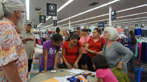 Families who lost their homes in the Clayton fire and whose children attend school in the Konocti Unified School District pick up gift cards at the Walmart store in Clearlake, Calif., on Wednesday, August 24, 2016. Photo by Elizabeth Larson/Lake County News. 082416brownwalmart1