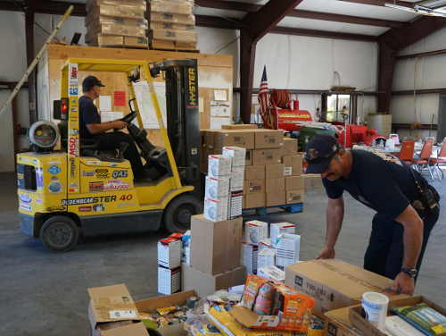 Lake County Fire Capt. Bill Inman, right, works to rearrange supplies at Lake County Fire Protection District’s Station 65 in Lower Lake, Calif., on Sunday, August 28, 2016. Photo by Elizabeth Larson/Lake County News. 082816lakecofireboxes