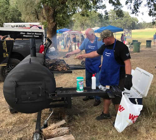 Public safety officers visited by Thompson, McGuire at annual campout