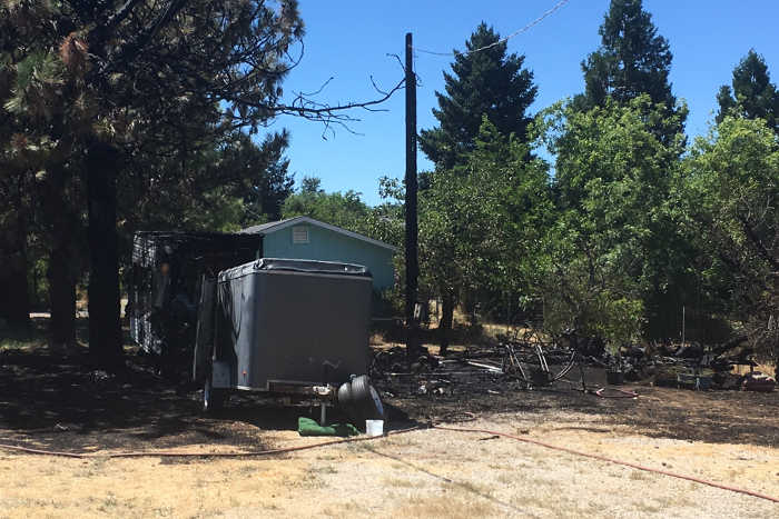 Wednesday fire destroys travel trailer; mowing prevented fire’s spread