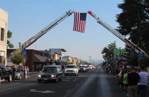  Procession returns body of fallen deputy home