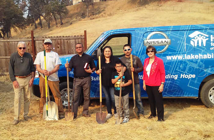 Habitat for Humanity Lake County’s latest groundbreaking ceremony took place on Tuesday, October 18, 2017, in Lower Lake, Calif. Pictured from left to right are Habitat for Humanity Lake County President Richard Birk; Rick Smith; Father Bernard D’Sa; homeowners Angelica Guerrero and Alberto Torrez and their son; and Habitat for Humanity Lake County Treasurer Angela Birk. Courtesy photo. Habitat for Humanity breaks ground on latest home project for Clayton fire survivors