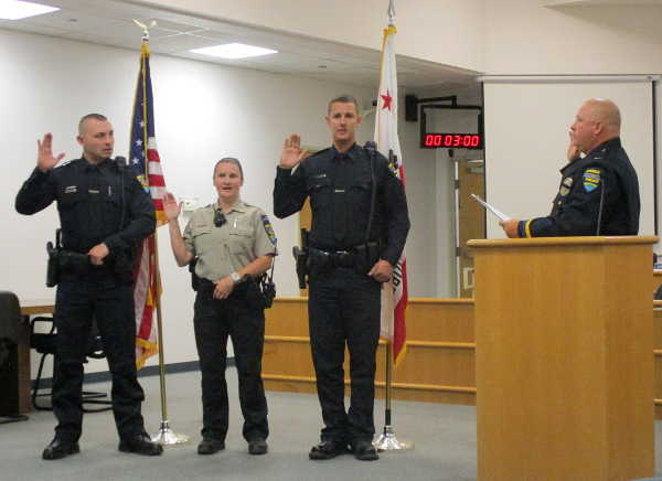 From left, Clearlake Police officers Mauricio Barreto and Jonathon Reynolds, and Animal Control Officer Melinda Wymer are sworn in by acting Clearlake Police Chief Tim Celli on Thursday, August 31, 2017, at City Hall in Clearlake, Calif. Courtesy photo. Clearlake hires new officers for police department, animal control
