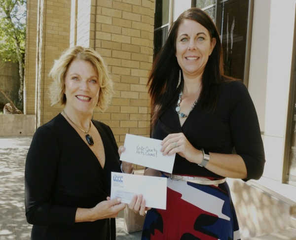 Supervisor Tina Scott, at right, presents a check for $1,000 to Lake County Arts Council President Conni Lemen-Kosla for the Arts in School program. Photo courtesy of the Lake County Arts Council. Supervisor Scott donates to ‘Arts in School’ program